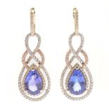 Pair of Tanzanite, Diamond, 14k Gold Earrings. Each featuring one pear-cut tanzanite weighing