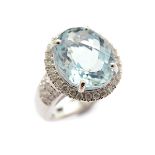 Aquamarine, Diamond, 14k White Gold Ring. Centering one faceted top oval aquamarine weighing