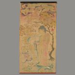 An Asian Buddhist Silk Scroll Painted in subtle colors with a standing robed Buddha figure holding a