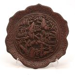 A Cinnabar Lacquer Dish Carved in high relief with figures in an extended garden setting, with