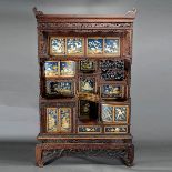 A Japanese Wood Display Cabinet with Embellished Decoration The alternating shelves and compartments