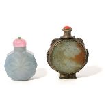 Two Jade Snuff Bottles The first is of octagonal form carved with a floral design, the the semi-