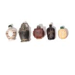 Five Organic Material Snuff Bottles The first is a hornbill cask bottle carved with opposing