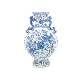 An Underglaze Blue Moonflask  Of circular form painted with opposing phoenix within floral sprays on