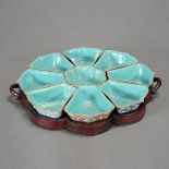 A Famille Rose Sweet Meat Tray Set The nine shaped bowls designed to fit together, enameled to the