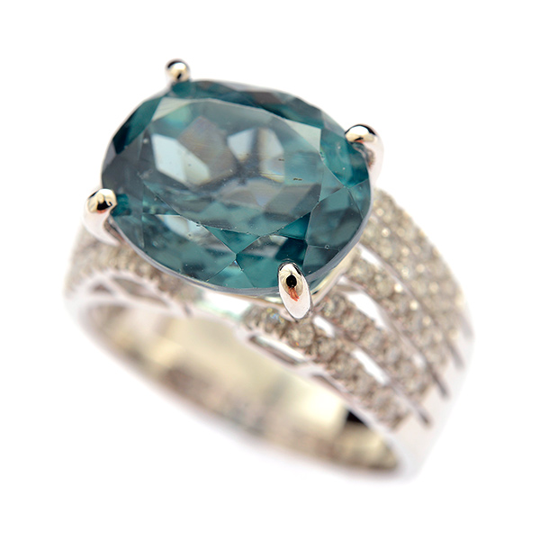 Blue Zircon, Diamond, 14k White Gold Ring. Featuring one oval-cut blue topaz weighing
