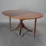 Baker Mahogany Pedestal Dining Table, with two leaves {Height 29 inches, diameter 46 1/2 inches;