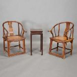 A Chinese Hardwood Armchair Suite Including a pair of horseshoe back armchairs carved with qilin