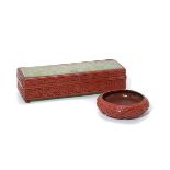 Two Cinnabar Lacquer Wares The first is a rectangular box with four internal compartments and raised