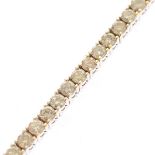 Diamond, 14k White Gold Bracelet. Featuring sixty full-cut diamonds weighing a total of