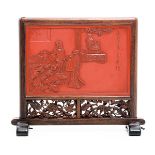 A Cinnabar Lacquer Table Screen The rectangular screen carved with two figures to one side, the