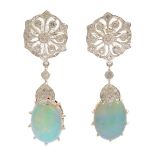 Pair of Opal, Diamond, 14k White Gold Earrings. Each features one oval opal cabochon, accented by