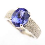 Tanzanite, Diamond, 14k White Gold Ring. Featuring one oval-cut tanzanite weighing approximately 3.