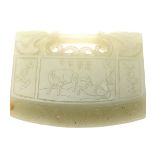 A Celadon Jade 'Lock'  Thickly sectioned and carved to each side as a pair of inward-facing