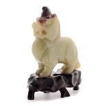 A Yellow Jade Qilin, Qing Dynasty   A Yellow Jade Qilin The regal beast shown standing with a
