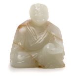 A Jade Carving of an Arhat   A Jade Carving of an Arhat Carved seated at ease in long robes, the