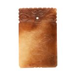 A Russet Jade Plaque   A Russet Jade Plaque The rectangular plaque carved to the top with ruyi