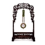 A Jadeite Clock Ensemble   A Jadeite Clock Ensemble The Shreve & Co. clock set within a round-