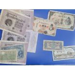 A 1940's Japanese 100 yen note, a Chinese 1949 1,000 yuan note, a German 100,000 mark note and eight