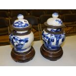 A pair of Oriental blue & white crackle glaze vases with bronze coloured borders