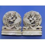 A pair of Chinese pale green soapstone bookends carved ho-ho birds with peony