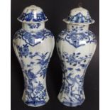 A pair of late 18th/early 19thC Chinese blue & white porcelain covered vases, of fluted baluster