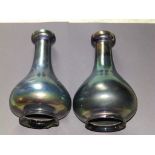 A pair of iridescent green glass shades (?) of vase form, 10.5” high – one chipped to base  - From