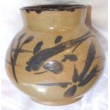 A studio pottery vase, decorated in dark brown slip with a stylized fish, incised mark -'JGS?', 5”