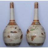 A pair of Japanese Meiji period Satsuma bottle vases, decorated in enamels and gilt depicting