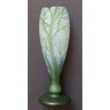 A signed Devez green cameo glass vase, of tulip form, decorated with a winter country landscape with