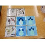 Four coloured earthenware wall tiles – named birds and four art nouveau tiles (8)