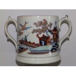 A late 19th/early 20thC Staffordshire colour decorated chinoiserie loving cup, 7.75” across handles