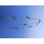 An emerald & diamond set fine link platinum coloured necklace chain,  24”