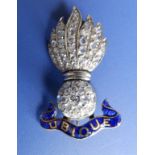 A Grenadiers diamond set sweetheart brooch