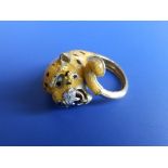 A bold enamelled '750' yellow metal leopard ring, set small diamonds to muzzle