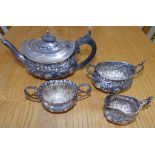 A three piece embossed silver bachelor's tea service – WH & Co, London 1894 and a Birmingham cream