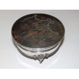 A circular silver jewellery box with hinged tortoiseshell cover inlaid neoclassical silver festoons,
