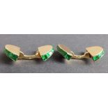 A cased pair of early 20thC Cartier emerald set 18ct yellow gold cufflinks, of semi-circular