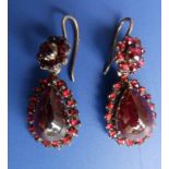 A pair of pendeloque garnet cluster drop earrings