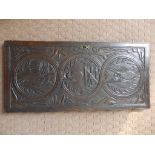 A carved antique oak cupboard door panel – 31.5” x 14.75”