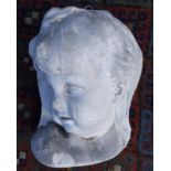 A Victorian plaster plaque in high relief of a child's head