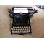 An old Corona portable typewriter in case