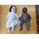 A German 'Welsch' bisque head baby doll and a black baby doll – a/f (2)