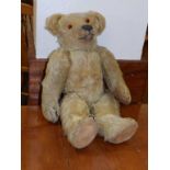 A large early 20thC teddy bear with growler and jointed limbs, 34”