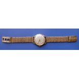 A 1950's gent's Jaeger-LeCoultre wrist watch, the silvered dial with centre seconds, gold batons &