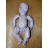 A bisque head baby girl doll by Bergmann