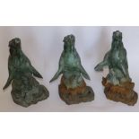 A set of three bronze fountain heads each in the form of a sea lion with her pup beneath,  astride a