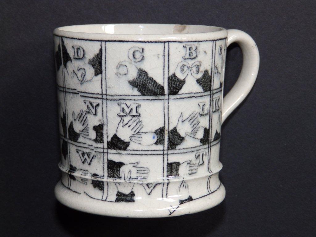 A rare 19thC child's pearlware mug decorated in black transfer with the ...