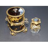 A 19thC French cylindrical tortoiseshell scent bottle case with gilt metal mounts, containing a