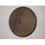 A 19thC Sudanese circular hide shield, 13.5” diameter